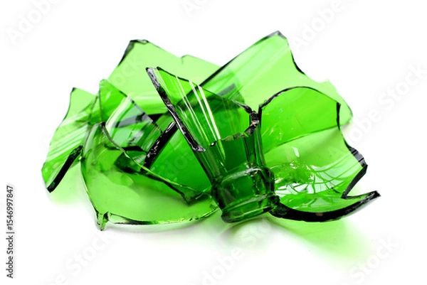 Fototapeta Sharp green glass shards scattered on a white background.