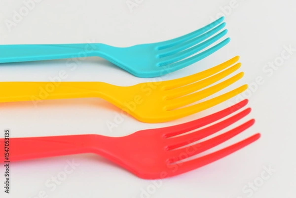 Fototapeta colorful fork isolated on white background, plastic cutlery for picnic