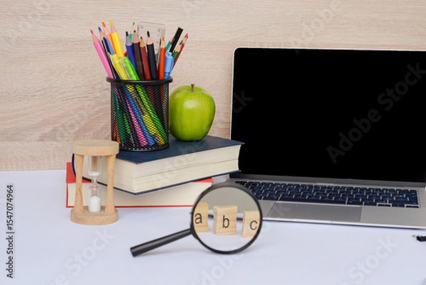 Fototapeta Study Essentials for Success Including Laptop, Books, and Various Supplies for Effective Learning