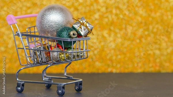 Fototapeta A delightful Shopping Cart filled with various vibrant and colorful Christmas Ornaments
