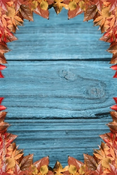Fototapeta Wooden plank surface is featuring rustic flat design with autumn leaf border in muted blue