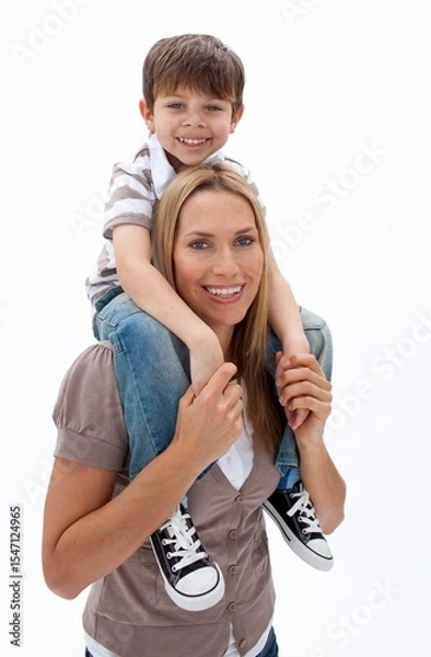 Obraz Smiling mother carrying son on shoulders