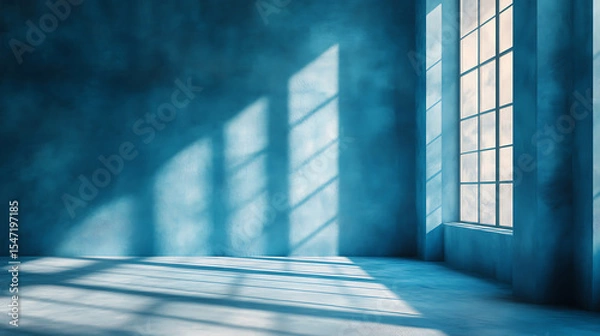 Fototapeta Empty blue room with window light and shadows creating a dramatic and minimalist atmosphere for interior design