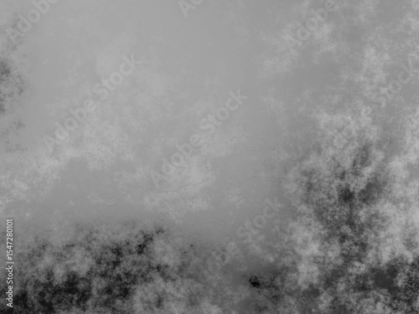 Fototapeta Light gray grunge texture with soft smoky details and a touch of dark accent.