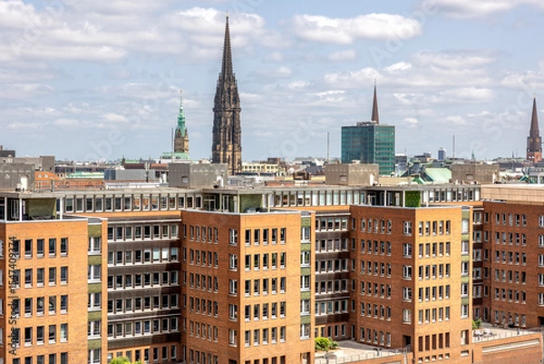 Obraz City skyline. Architectural spires. Brick development.