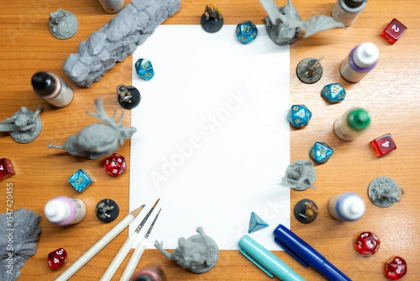 Obraz Blank white paper place with miniatures and dice role playing tabletop game and board game mockup
