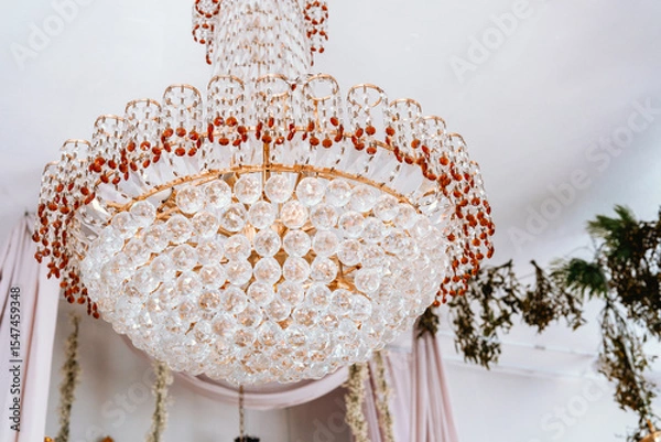 Obraz Elegant crystal chandelier hangs in modern interior space with artistic decor