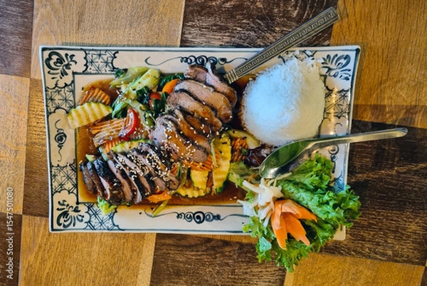 Fototapeta Grilled Teriyaki Chicken with Rice and Veggies on Decorative Plate for Food Presentation