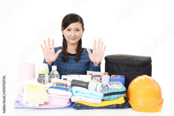 Obraz 防災グッズと若い女性