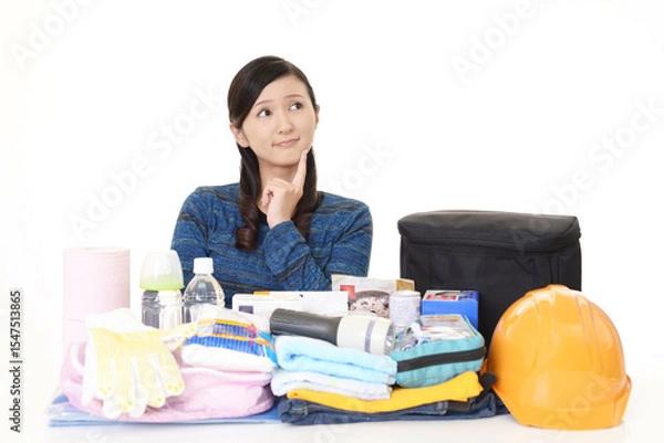 Obraz 防災グッズと若い女性