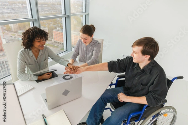 Fototapeta Stack of hands. Business startup teamwork unity concept. Top view of diverse multiracial business people putting hands together. Business colleagues during work process rejoice in success of company