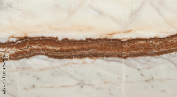 Fototapeta Close up of a white and brown marble texture with a horizontal band across the center of the image