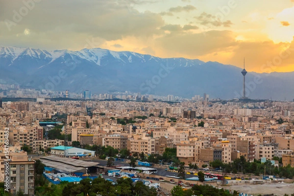 Obraz Beautiful cityscape sunset panorama of Tehran city, mountains and Milad tower in during colorful sunset in Iran