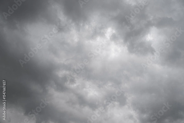 Fototapeta Rain cloud in the sky. Background of dark clouds before thunder storm and rain. Abstract dramatic clouds sky.