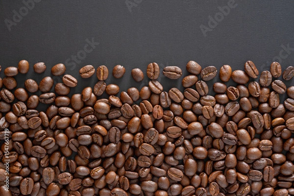 Fototapeta Coffee beans background. Top view coffee beans with copy space area for your text. Close up image.
