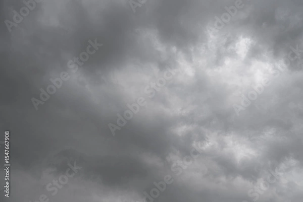 Fototapeta Rain cloud in the sky. Background of dark clouds before thunder storm and rain. Abstract dramatic clouds sky.