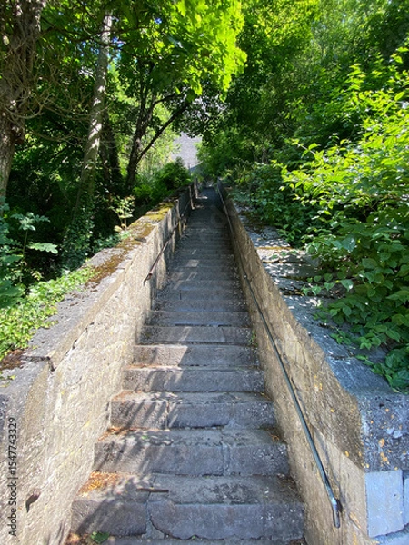 Obraz Dramatic perspective view of the steep staircase leading up to the Dinant citadel in Belgium, with stone steps and handrails under daylight.