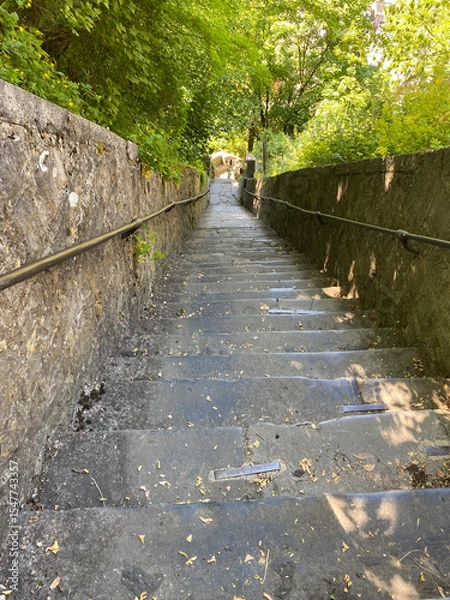 Obraz Dramatic perspective view of the steep staircase leading up to the Dinant citadel in Belgium, with stone steps and handrails under daylight.