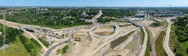 Fototapeta Krakow, Poland. Grebalow large highway and tramway interchange under construction. The fragment of S7 from Warsaw to A4 and last fragment of ring road around Krakow. Aerial view. State in January 2025
