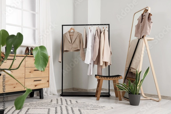 Fototapeta Interior of clothes stylist's studio with rack and mirror