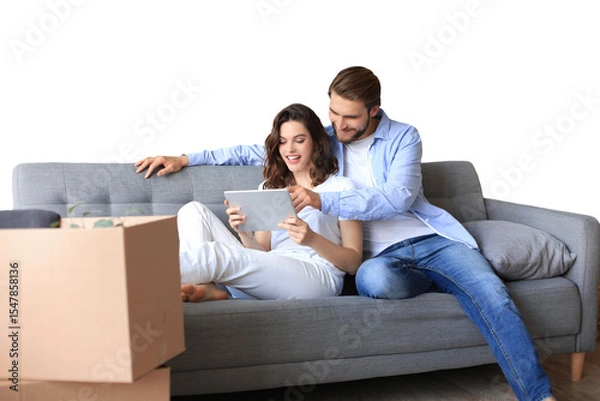 Fototapeta Happy couple sitting and planning new home decoration at home with a tablet at moving day, renovation and interior design for new house on a transparent background