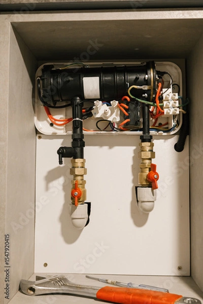 Fototapeta Indoor heating system maintenance with tools and pipes