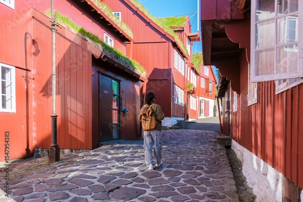 Fototapeta Discovering the charm of traditional red houses in the Faroe Islands
