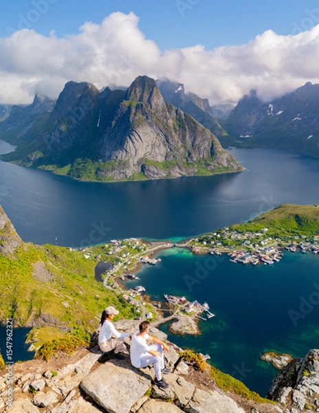 Fototapeta Stunning panoramic view of Lofoten Islands with hikers overlooking the fjord in Norway