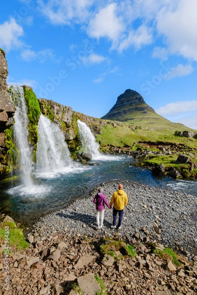 Fototapeta Discovering the natural beauty of Kirkjufell mountain and waterfall in Iceland