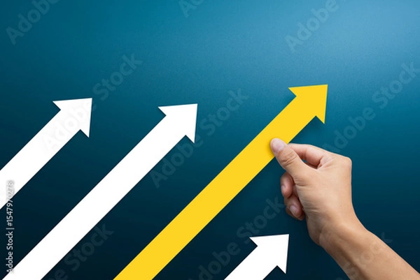 Obraz Business competition concept. Businessman pushing arrow up.