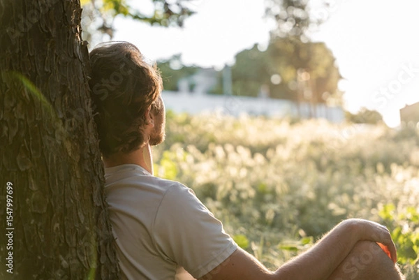 Fototapeta Relaxed man enjoying good weather in a natural setting