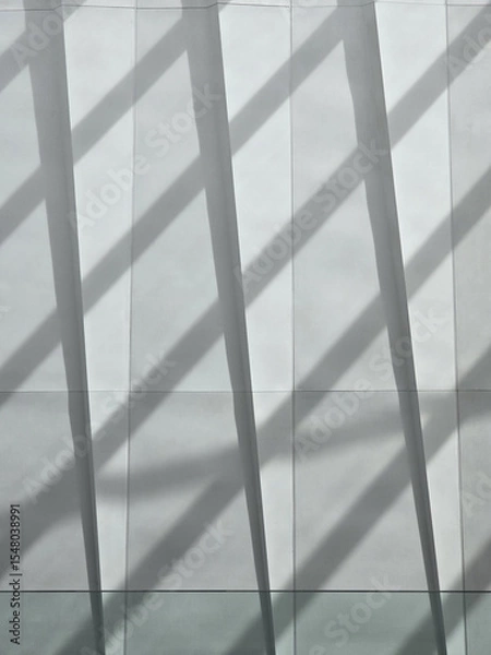 Obraz Modern architectural wall with shadows creating dynamic patterns