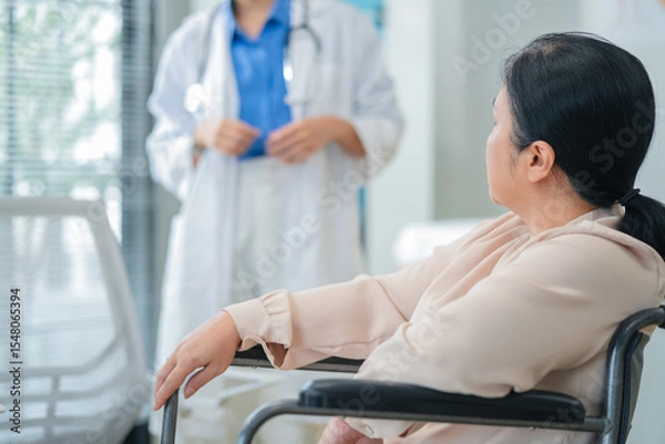Fototapeta experienced female medical professional explains test results to a female patient during a clinic consultation. reviewing reports and discussing diagnosis and treatment options.compassionate care