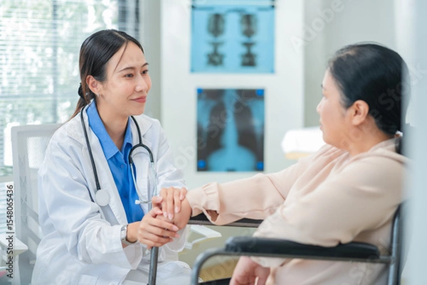 Fototapeta experienced female medical professional explains test results to a female patient during a clinic consultation. reviewing reports and discussing diagnosis and treatment options.compassionate care