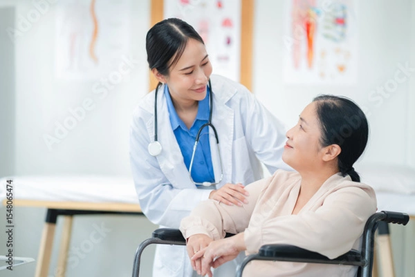 Fototapeta experienced female medical professional explains test results to a female patient during a clinic consultation. reviewing reports and discussing diagnosis and treatment options.compassionate care
