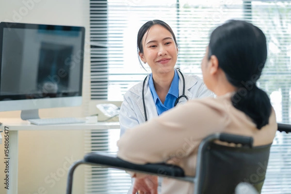 Fototapeta experienced female medical professional explains test results to a female patient during a clinic consultation. reviewing reports and discussing diagnosis and treatment options.compassionate care