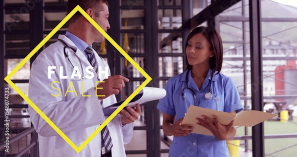 Obraz Doctor in lab coat, nurse in scrubs standing in clinic corridor, with stethoscopes, flash sale sign