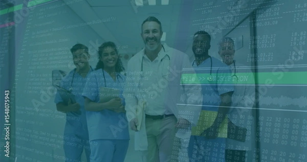 Obraz Standing physician in white coat holding patient files in corridor with nurses and code overlay