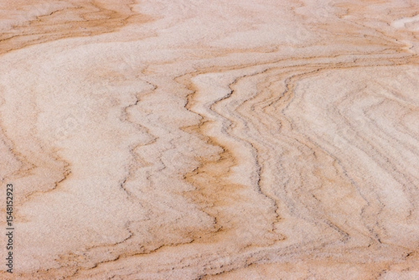 Fototapeta Drifting snow accented with drifting sand create an abstract image on the beach at Harrington Beach State Park, Belgium, Wisconsin