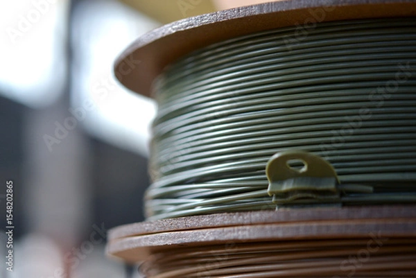 Fototapeta Plastic wire for 3d printer. Spools of plastic threads for printing on 3D printer. Spool of filament. Plastic for 3D printer. Components for 3D printing. New modern additive printing FDM technology