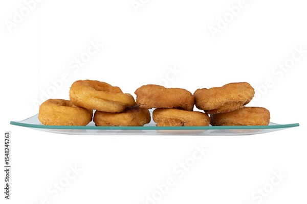 Fototapeta Homemade lemon doughnuts, fried and glazed, close-up and isolated on white background