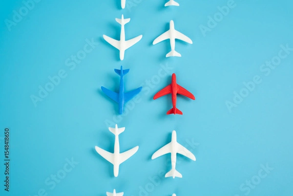 Fototapeta Two planes and two oppositely directed flows of aircraft. Competition in aerospace. Broader industry polarization. Competing airlines