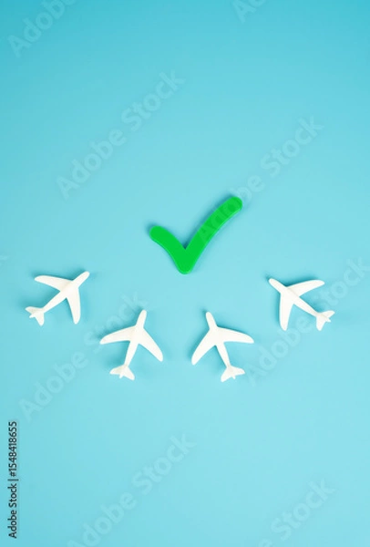 Fototapeta Airplanes and the permission tick. Lifting emergency measures and permission to fly. Recovery in aviation, post-pandemic normalization, or relaxation of travel restrictions.
