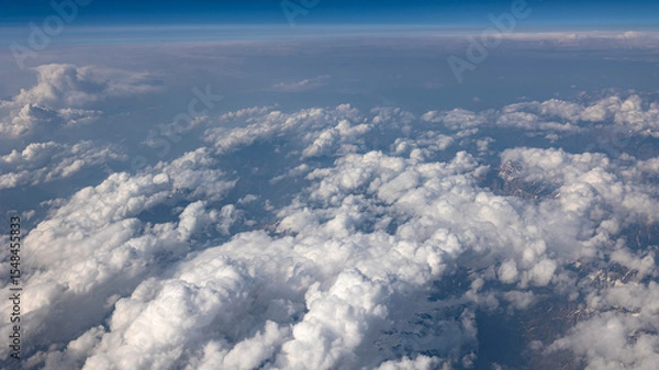 Fototapeta A Breathtaking Scenic Aerial View of Billowing Clouds Floating Above a Beautiful Landscape