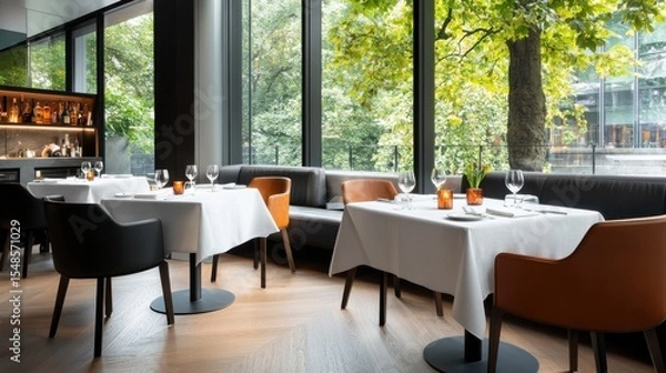 Obraz Elegant dining experience in a modern restaurant with large offering a serene view of the lush natural surroundings