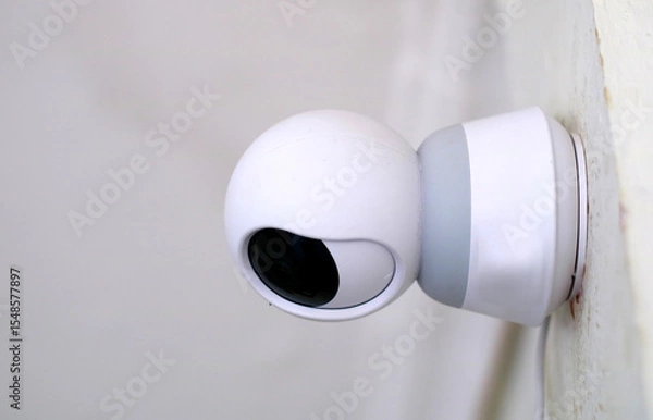 Obraz CCTV camera installed on the wall of the house.