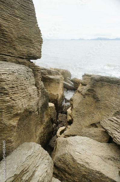 Fototapeta The unique and beautiful shape and composition of rocks at Waipu pancake rocks, New Zealand.