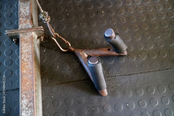 Fototapeta Rusty Gym Equipment Handle on Textured Floor
