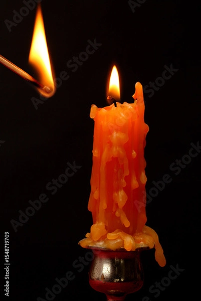 Obraz  lit candle on  black