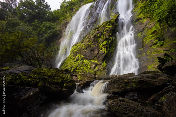 Fototapeta 
Khlong Lan Waterfall is one of the most beautiful and grand waterfalls in Thailand. Below it is a large pool where you can swim. It is located in Khlong Lan National Park, Kamphaeng Phet
